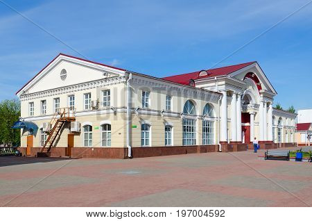 POLOTSK BELARUS - MAY 19 2017: Unknown woman goes to railway station building Polotsk Belarus