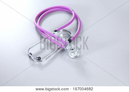 Medical stethoscope on white background. Selective focus