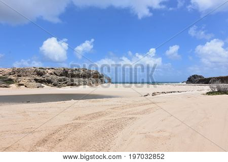 Bluffs lining the cove at Andicuri Beach in Aruba.