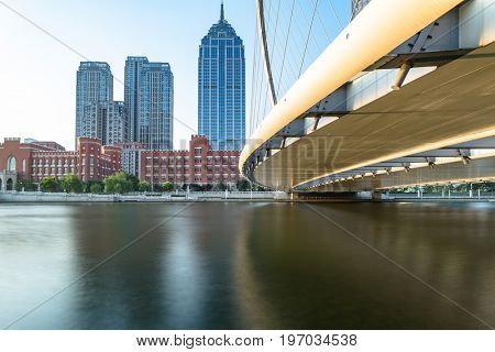 Tianjin city waterfront downtown skyline with Haihe river,China.