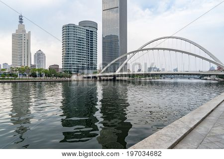 Tianjin city waterfront downtown skyline with Haihe river,China.