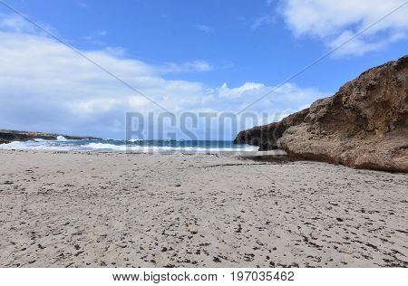 Rocky bluff bordering Andicuri Beach in Aruba.