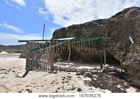 The remains of a ramshackle shade shelter on Andicuri Beach in Aruba.
