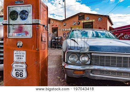 Old car and historical gasoline pump on Route 66