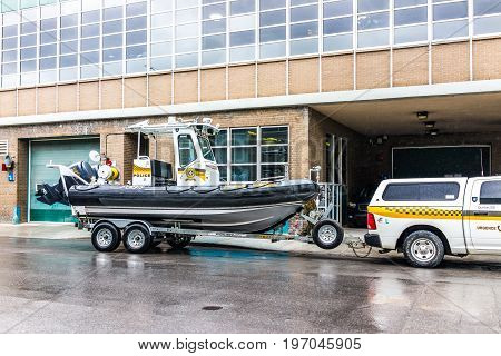 Montreal, Canada - May 26, 2017: Police Station With Car And Boat In City In Quebec Region During Ra