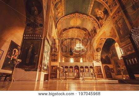 MTSKHETA, GEORGIA - OCT 13, 2016: Icons and tall walls of old church with sanctuary and frescoes at the Shio-Mgvime monastery on October 13, 2016. Christian monastery built in 6th century