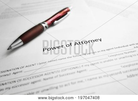 Power of Attorney legal document and pen