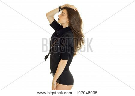 Young slim sexy brunette woman in black jacket and panties isolated on white background