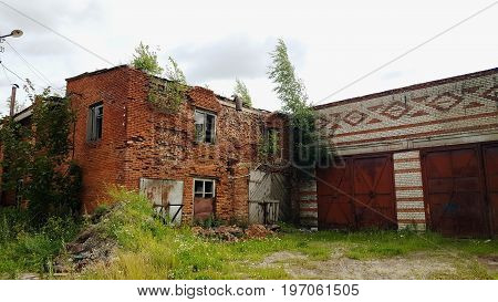 Ruins of brick building. Destroyed house without roof.