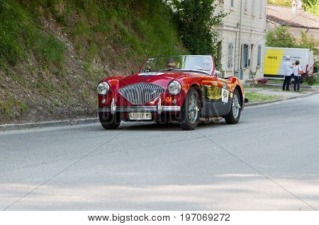 GOLA DEL FURLO, ITALY - MAY 19: AUSTIN HEALEY 100/4 1956 on an old racing car in rally Mille Miglia 2017 the famous italian historical race (1927-1957) on May 19 2017
