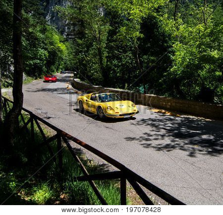 GOLA DEL FURLO, ITALY - MAY 19: FERRARI 246 DINO GTS 1973 on an old racing car in rally Mille Miglia 2017 the famous italian historical race (1927-1957) on May 19 2017