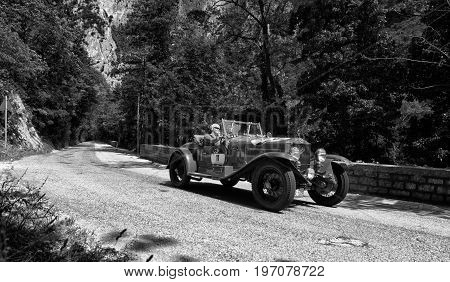 GOLA DEL FURLO, ITALY - MAY 19: O.M. 665 SUPERBA 1927 on an old racing car in rally Mille Miglia 2017 the famous italian historical race (1927-1957) on May 19 2017