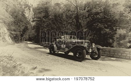 GOLA DEL FURLO, ITALY - MAY 19: O.M. 665 SUPERBA 1927 on an old racing car in rally Mille Miglia 2017 the famous italian historical race (1927-1957) on May 19 2017