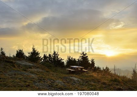 Sunrise In The Mountains And Wooden Table