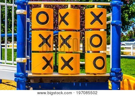 Tic Tac Toe Game On Children's Playground Set At Local Park