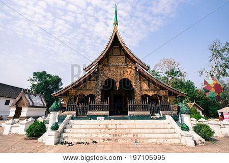LUANG PRABANG LAOS - MARCH 11 2017: Front side picture of the Wat Xieng Thong Buddhist temple located in the city Luang Prabang capital of Laos.