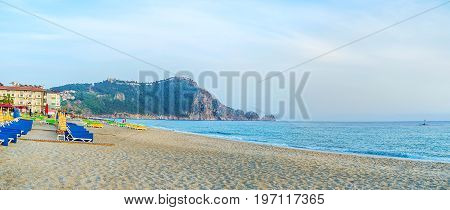 Panorama of Kleopatra beach in Alanya with the rocky peninsula on background, Turkey.