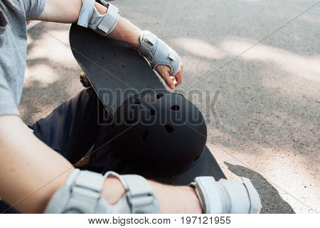 Skateboard halmet and gloves acessrise. Head and hands care protection from injoury. Extreme sport headwear stuff for skater