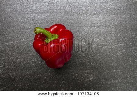 Red sweet pepper. Sweet Pepper are rich sources of antioxidants and vitamin C.Top view with copy space. Dark background.