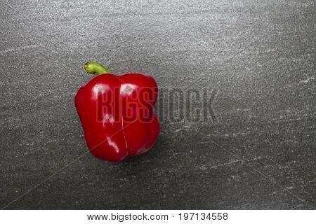 Red sweet pepper. Sweet Pepper are rich sources of antioxidants and vitamin C.Top view with copy space. Dark background.