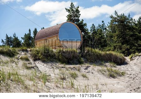 Europe Latvia Cape Kolka. House in the form of a barrel on the dunes for a double stay at the coast of the Baltic Sea.