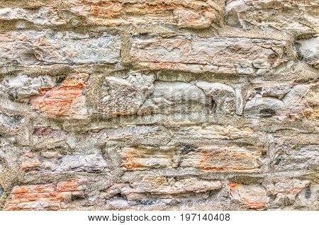 Closeup of old colorful stone wall in Quebec City old lower town showing detail and texture