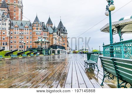Quebec City, Canada - May 30, 2017: Old Town Street And View Of Hotel Chateau Frontenac With Cannons