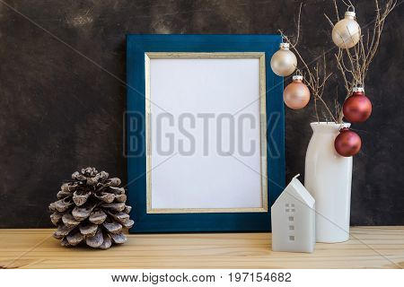 Christmas New Yera blue and golden frame mockup with blank space for text artwork colorful baubles house candle pine cones minimalist style scandinavian kinfolk