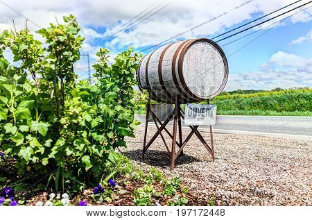 Wine Barrel Sign In French Countryside With Ouvert Open Sign By Road