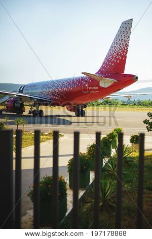 July 2017, Tivat, Montenegro. The red passenger airliner of Russia on the runway at Tivat airport is waiting for passengers to board and take off.