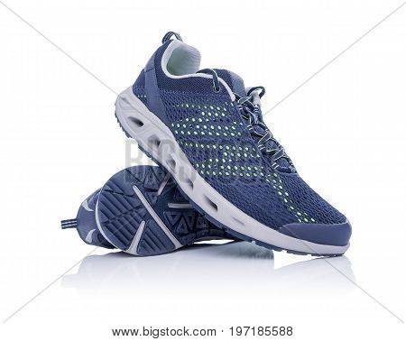 Unbranded modern sneakers isolated on a white background. Blue sneakers.