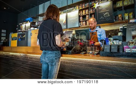 Istanbul, Turkey - June 02, 2017: Barista And Customer At Starbucks Coffee Shop In Istanbul.