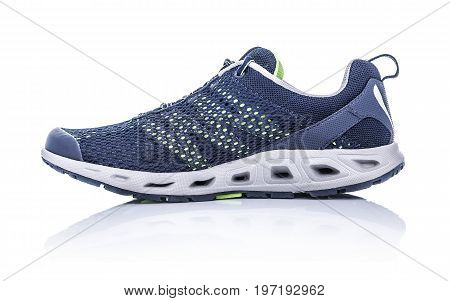 Unbranded modern sneaker isolated on a white background. Blue sneaker.