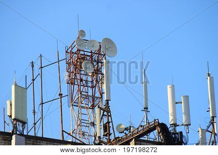 Telecommunication Base Stations Network Repeaters On The Roof Of The Building. The Cellular Communic