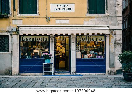 VENICE, ITALY - JULY 01, 2017: Small book bindery shop in Venice. Venice is an popular tourist destination for its uniqueness and celebrated art.