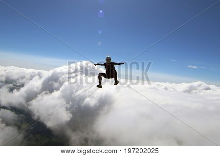 Skydiving over beautiful Norway. Clouds, sun and sky