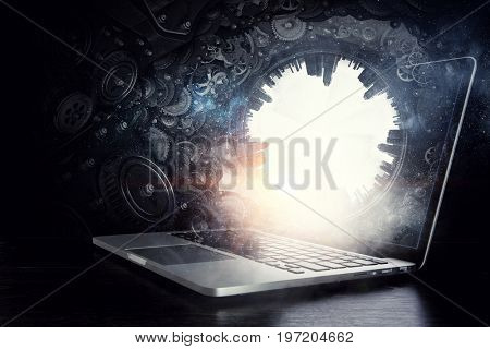 Laptop and construction concept. Mixed media