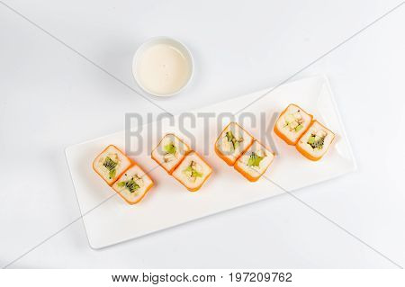 Dessert Maki Sushi - Roll With Various Fruit In Rice Pudding And Coconut Flakes