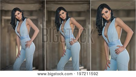Portrait of beautiful sexy young woman with elegant overall, in urban background. Attractive young brunette with long hair and blue eyes posing fashion in white outfit. Perfect body woman, side view
