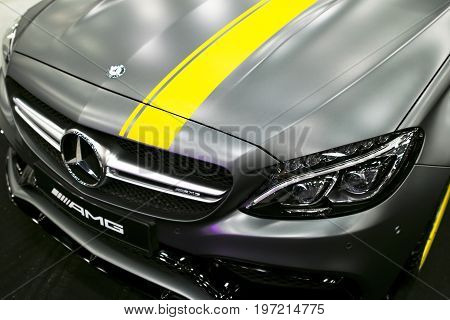 Sankt-Petersburg Russia July 21 2017: Front view of a Mercedes Benz C 63s coupe 2017. Front Headlight. Dark Matt colour .Car exterior details. Photo Taken at Royal Auto Show July 21