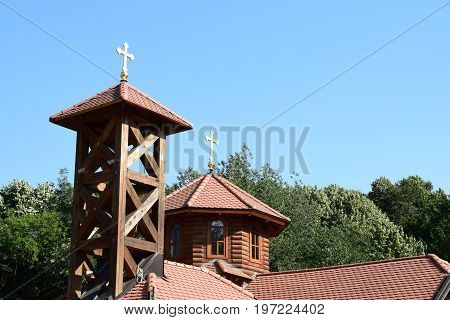 Bell tower of the wooden church in the wood