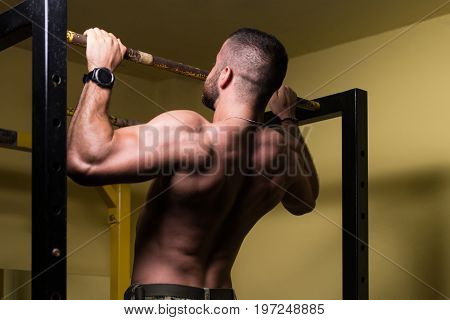 Man Doing Pull Ups Best Back Exercises