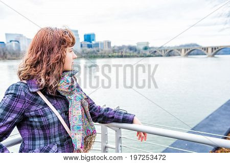 Profile Side Portrait Of Young Woman Looking Over Potomac River Key Bridge And Arlington Skyline In