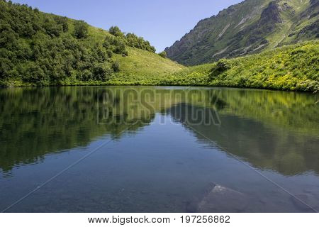 Lake valley of Dzitaku in the mountains of the Caucasian range, Krasnaya Polyana, Sochi, Russia