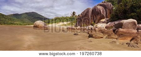 A sandy beach with rocks in Finch Bay Cooktown Australia