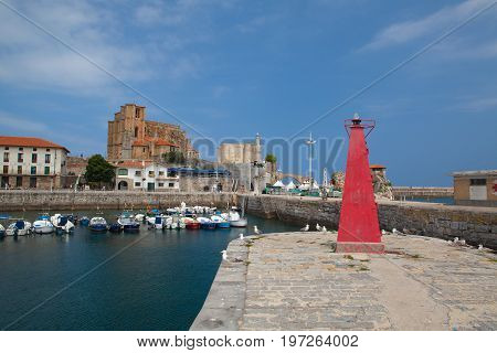 Castro Urdiales Spain - July 9 2017: Harbor in Castro Urdiales.It is a seaport situated on the bay of Biscay and a modern town although its castle and the Gothic style parish church of Santa María de la Asunción date from the Middle Ages.