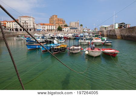 Castro Urdiales Spain - July 9 2017: Harbor in Castro Urdiales.It is a seaport situated on the bay of Biscay and a modern town although its castle and the Gothic style parish church of Santa María de la Asunción date from the Middle Ages.