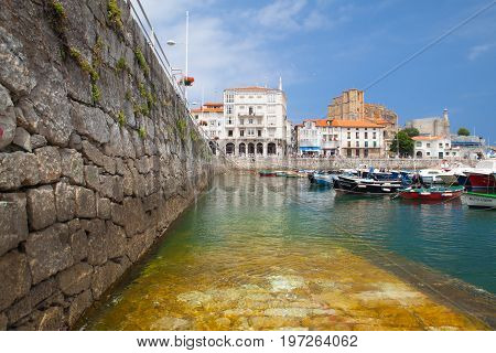 Castro Urdiales Spain - July 9 2017: Harbor in Castro Urdiales.It is a seaport situated on the bay of Biscay and a modern town although its castle and the Gothic style parish church of Santa María de la Asunción date from the Middle Ages.