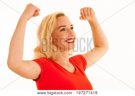 Attrctive Young Blonde Woman Gesture Success With Arms Up Isolated Over White Background