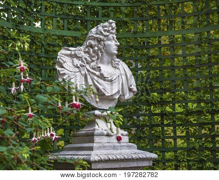 Linderhof, Germany - October 2017: Ludwig II statue I n the autumn park of Linderhof Palace